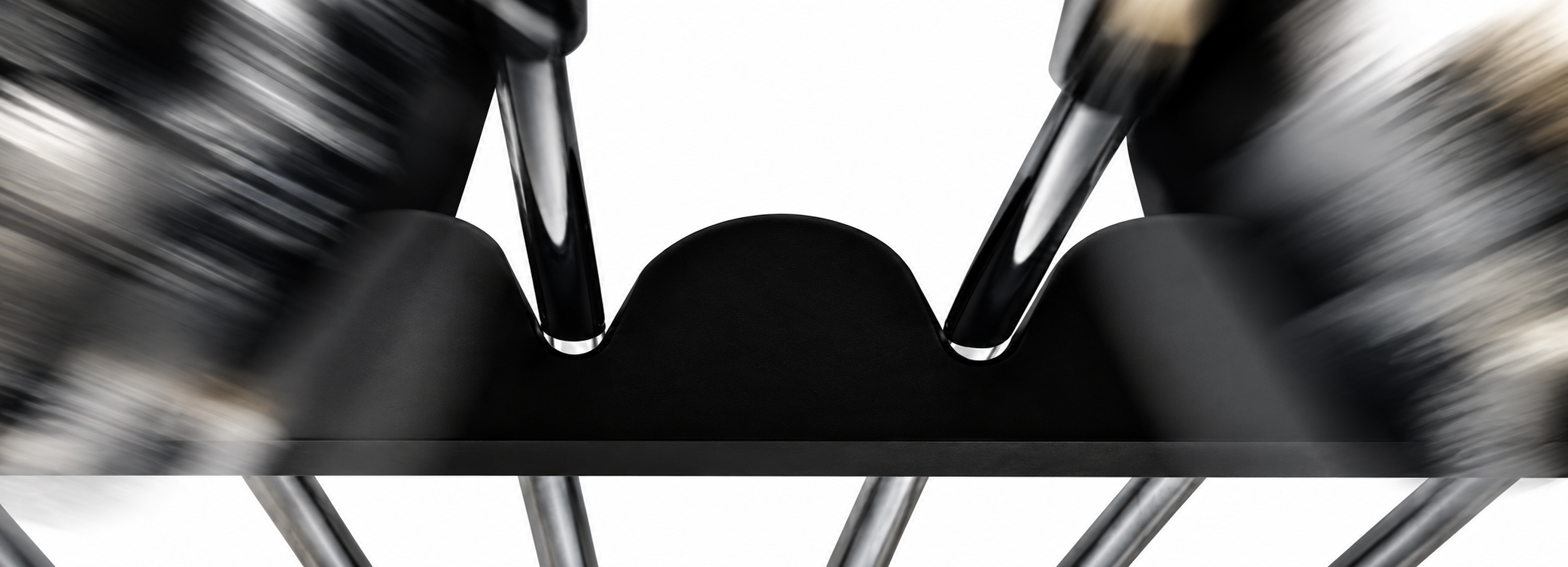 Close-up showing a golf club supported at two distinct contact points in the Golfanizer